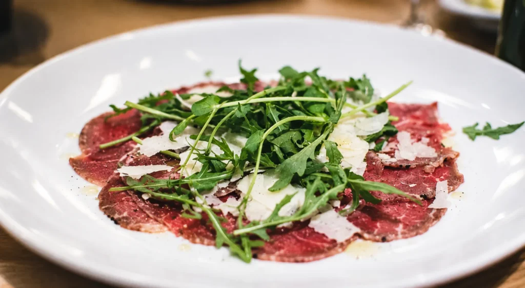 Bresaola Carpaccio with Rocket Leaf, prepared and ready to serve.