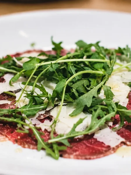 Bresaola Carpaccio with Rocket Leaf, prepared and ready to serve.