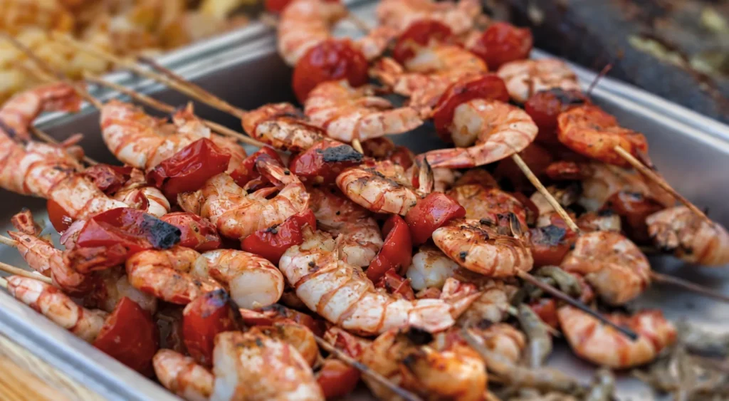 Fantail Shrimp with Tomato Kebabs and Whitebait, prepared and ready to serve.