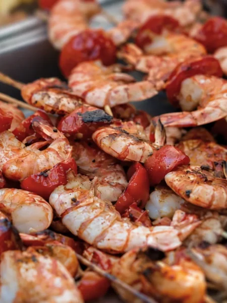 Fantail Shrimp with Tomato Kebabs and Whitebait, prepared and ready to serve.