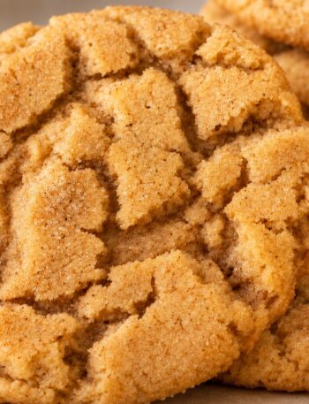 Rustic golden cinnamon and brown sugar crinkle cookies with naturally cracked tops.